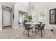 Bright dining area with modern lighting fixture, slider, and tile flooring at 8163 Upper Perse Cir, Orlando, FL 32827