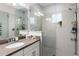 The tiled glass shower features updated fixtures and ample space at 8163 Upper Perse Cir, Orlando, FL 32827