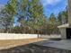 Spacious backyard is fully fenced for privacy and provides a tranquil wooded view from the back patio at 8315 Sw 135Th Street Rd, Ocala, FL 34473