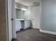 Bathroom with white cabinets, sink, and wood-look flooring at 8315 Sw 135Th Street Rd, Ocala, FL 34473