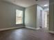 Bedroom featuring a large window with an outdoor view and light-colored walls at 8315 Sw 135Th Street Rd, Ocala, FL 34473