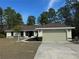 Charming one-story house featuring an attached two-car garage and well-kept landscaping at 8315 Sw 135Th Street Rd, Ocala, FL 34473