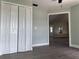 Bright hallway featuring wood floors, fresh paint, and a closet at 8315 Sw 135Th Street Rd, Ocala, FL 34473