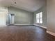 Spacious room featuring wood floors, fresh paint, and bright windows at 8315 Sw 135Th Street Rd, Ocala, FL 34473