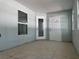 Enclosed porch featuring ceramic tile floors, a window, and two exterior doors at 8315 Sw 135Th Street Rd, Ocala, FL 34473