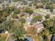 This aerial view showcases the home's secluded lot, mature trees, and quiet neighborhood at 8413 Commander Cv, Winter Park, FL 32792