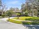 Inviting two-story home featuring manicured lawn, mature trees, and an attached two-car garage in a desirable neighborhood at 8413 Commander Cv, Winter Park, FL 32792