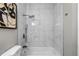 Bathroom featuring white marble tiled shower/tub at 8523 Fort Clinch Ave, Orlando, FL 32822