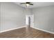 Spacious bedroom with wood-look tile floors and ceiling fan at 8523 Fort Clinch Ave, Orlando, FL 32822