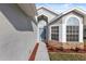 Stylish front entrance with a charming blue door and decorative brick accents at 8523 Fort Clinch Ave, Orlando, FL 32822