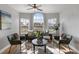 Well-lit living room with stylish furniture and a ceiling fan, perfect for relaxation at 8523 Fort Clinch Ave, Orlando, FL 32822