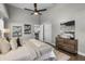 Comfortable main bedroom with vaulted ceiling, a ceiling fan, and a view into the ensuite bathroom at 8523 Fort Clinch Ave, Orlando, FL 32822