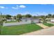 Aerial view of a well-maintained home with a lush green lawn and a fenced yard at 867 N Halifax Dr, Ormond Beach, FL 32176