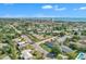 Expansive aerial view showcasing a residential area with ocean views and modern buildings in the distance at 867 N Halifax Dr, Ormond Beach, FL 32176