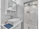 Stylish bathroom featuring a modern sink, vanity and a tiled glass shower at 867 N Halifax Dr, Ormond Beach, FL 32176