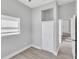 Cozy bedroom with built-in closet and large window providing natural light at 867 N Halifax Dr, Ormond Beach, FL 32176