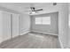 Neutral bedroom with a ceiling fan, window, and closet at 867 N Halifax Dr, Ormond Beach, FL 32176