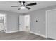 Modern bedroom featuring updated floors, gray walls, and a contemporary ceiling fan at 867 N Halifax Dr, Ormond Beach, FL 32176