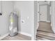 Utility room with modern water heater and convenient access to the hallway at 867 N Halifax Dr, Ormond Beach, FL 32176