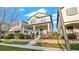 Attractive two-story home featuring a cozy front porch and beautiful landscaping at 9360 Meadow Hunt Way, Winter Garden, FL 34787