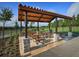 Covered picnic area with multiple tables and benches provides a great space for outdoor dining at 9360 Meadow Hunt Way, Winter Garden, FL 34787