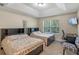 Bedroom with tray ceilings and two beds at 9559 Silver Buttonwood St, Orlando, FL 32832