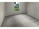 Bedroom with neutral walls and gray carpet at 1030 Plantation Dr # C6, Kissimmee, FL 34741