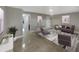 Staged living room with tile floor, modern furniture, neutral walls, and recessed lighting at 1030 Plantation Dr # C6, Kissimmee, FL 34741