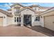 Elegant entryway featuring a stylish front door and stone accents at 1191 Terralago Way, Kissimmee, FL 34746