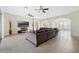 Open-concept living room featuring tile floors, recessed lighting, and multiple ceiling fans at 1191 Terralago Way, Kissimmee, FL 34746