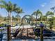 Picturesque garden setting with a butterfly sculpture, bridge, and lush tropical foliage at 1206 Normandy Dr, Haines City, FL 33844