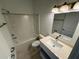 Bathroom featuring a shower and tub combination and a modern vanity at 1213 S Station Pl # 404, Orlando, FL 32827