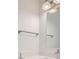 Modern bathroom with a square mirror, sleek lighting, and a towel bar at 1213 S Station Pl # 404, Orlando, FL 32809