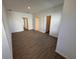 An empty bedroom has laminate flooring, a large closet and neutral paint at 1213 S Station Pl # 404, Orlando, FL 32827