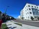 View of condo buildings from the road shows modern architecture and landscaping at 1213 S Station Pl # 404, Orlando, FL 32827