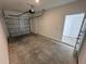 Spacious two car garage featuring concrete floors and a new door opener at 1213 S Station Pl # 404, Orlando, FL 32827