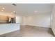 Open-concept living room with modern finishes and light-colored wood flooring at 1213 S Station Pl # 404, Orlando, FL 32809