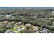 Aerial view of beautiful homes nestled among trees and ponds in a lovely neighborhood at 126 Seville Chase Dr, Winter Springs, FL 32708