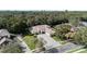 Aerial view of property showcasing the home, lush landscaping, and long driveway at 126 Seville Chase Dr, Winter Springs, FL 32708