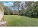 The property has an expansive backyard with mature trees for extra privacy at 126 Seville Chase Dr, Winter Springs, FL 32708