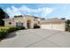 Charming home featuring a three-car garage, mature landscaping, and a light-colored exterior at 126 Seville Chase Dr, Winter Springs, FL 32708