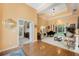 Bright living room boasting hardwood floors, tray ceiling and access to an outdoor patio at 126 Seville Chase Dr, Winter Springs, FL 32708