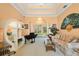 Elegant living room with a piano, shelving unit, and an ornate ceiling design at 126 Seville Chase Dr, Winter Springs, FL 32708