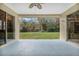 View from the covered patio to the beautiful and well-maintained backyard at 126 Seville Chase Dr, Winter Springs, FL 32708