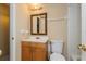 Bathroom featuring a vanity sink and toilet with a framed mirror at 133 Springwood Cir # A, Longwood, FL 32750