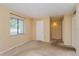 Neutral bedroom featuring neutral paint, carpet flooring, and a bright window at 133 Springwood Cir # A, Longwood, FL 32750