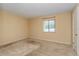 Cozy bedroom featuring neutral paint, carpet flooring, and a bright window at 133 Springwood Cir # A, Longwood, FL 32750