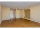 Living room with hard floors leading to tile-floored den or dining area at 133 Springwood Cir # A, Longwood, FL 32750