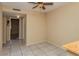 Bright living room featuring neutral paint, tiled flooring, and a ceiling fan at 133 Springwood Cir # A, Longwood, FL 32750