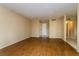 Spacious living room with laminate flooring, neutral walls, and white trim at 133 Springwood Cir # A, Longwood, FL 32750